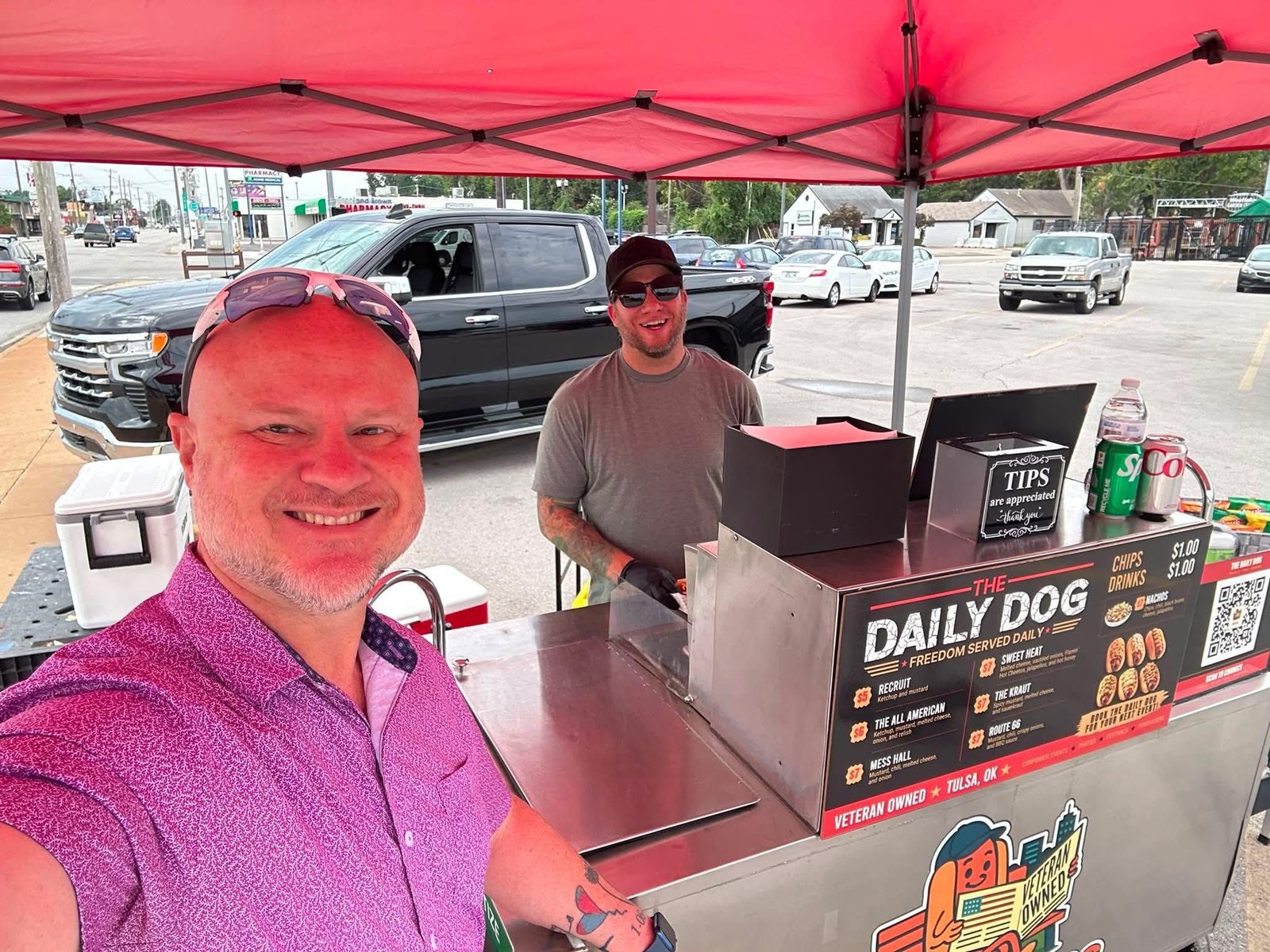 Friends visiting The Daily Dog cart